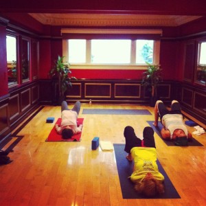 Students working on basic backbending in beginner's class.